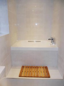 The Imersa soaking tub in its finished position, shown inset in a tiled surround.